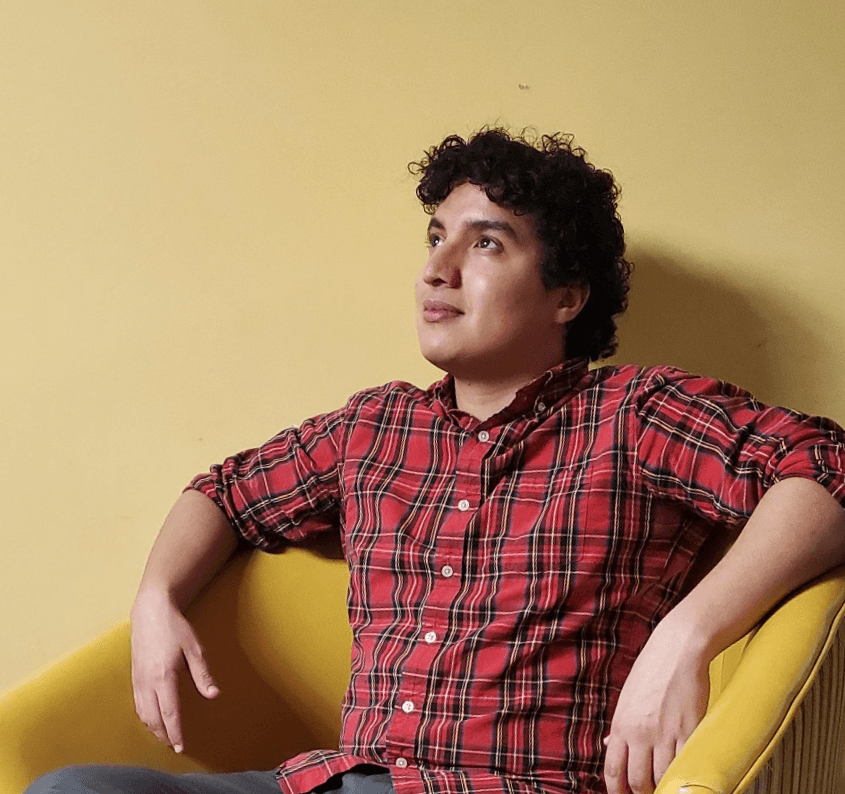 Ilyas Salhi sitting in a yellow chair